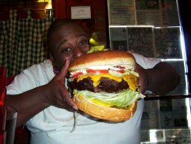 ai111.photobucket.com_albums_n137_mrboat_On_20the_20web_booker20eating20big20burger.jpg